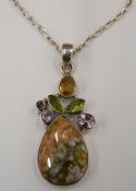 A multi-gem set silver pendant on chain. The pendant 4.