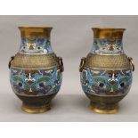 A pair of late 19th/early 20th century cloisonne decorated bronze vases. 29.5 cm high.