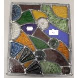 A leaded stained glass panel. 30.5 cm high.