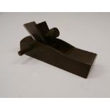 A bronze model of a wood plane. 9 cm long.