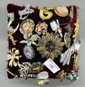 A collection of vintage brooches