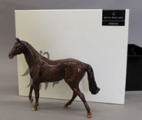 A boxed Royal Doulton figure of a thoroughbred horse. 22 cm wide.