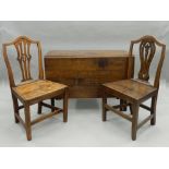A 19th century oak drop leaf table and two 19th century solid seated chairs. Table 104 cm wide.