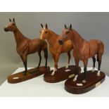 Three Royal Doulton racehorses, Nijinsky, Red Rum and Grundy. The latter 29.5 cm high.