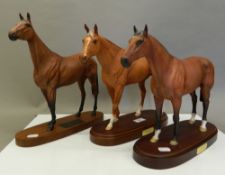 Three Royal Doulton racehorses, Nijinsky, Red Rum and Grundy. The latter 29.5 cm high.