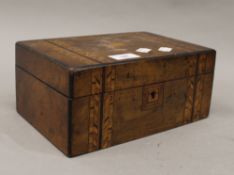 A Victorian inlaid walnut jewellery box. 24.5 cm wide.