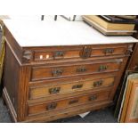 A 19th century Continental oak chest of drawers, with a marble top. 109 cm wide.