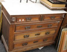 A 19th century Continental oak chest of drawers, with a marble top. 109 cm wide.