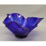 A large blue glass handkerchief vase. 39.5 cm wide.