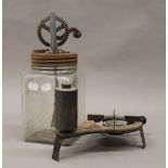 A vintage butter churn and a burner. The butter churn 31 cm high.