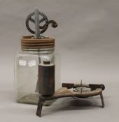 A vintage butter churn and a burner. The butter churn 31 cm high.