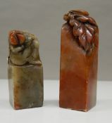 Two Chinese soapstone seals. 8 cm and 6 cm high respectively.