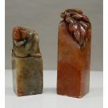 Two Chinese soapstone seals. 8 cm and 6 cm high respectively.