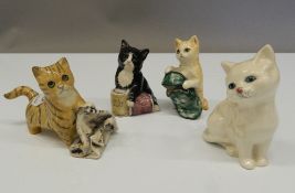 Four Royal Doulton models of kittens. The largest 8 cm high.