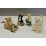 Four Royal Doulton models of kittens. The largest 8 cm high.