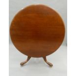 A Victorian mahogany tilt top breakfast table. 118 cm diameter.