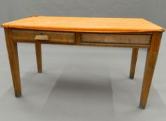 An early 20th century oak side table. 133 cm wide.