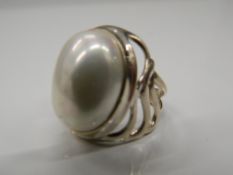 A silver dress ring. Ring size P.