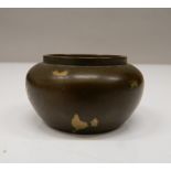 A small Chinese bronze censer. 2.5 cm high; 4.75 cm wide.