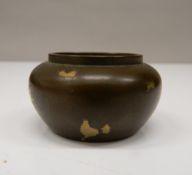 A small Chinese bronze censer. 2.5 cm high; 4.75 cm wide.