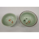 Two Chinese porcelain bowls decorated with fish. 7.5 cm and 6.5 cm diameter respectively.