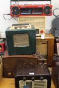 Eight vintage radios. The largest 50 cm wide.