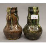A pair of Art Pottery vases. 18.5 cm high.
