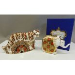 A boxed Royal Crown Derby elephant paperweight and an unboxed Bengal Tiger paperweight.