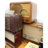 Four vintage radios. The largest 73 cm wide.