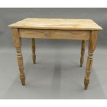 A Victorian pine table. 91.5 cm wide.
