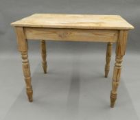 A Victorian pine table. 91.5 cm wide.