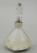 A glass scent bottle with clown formed stopper. 11.5 cm high.
