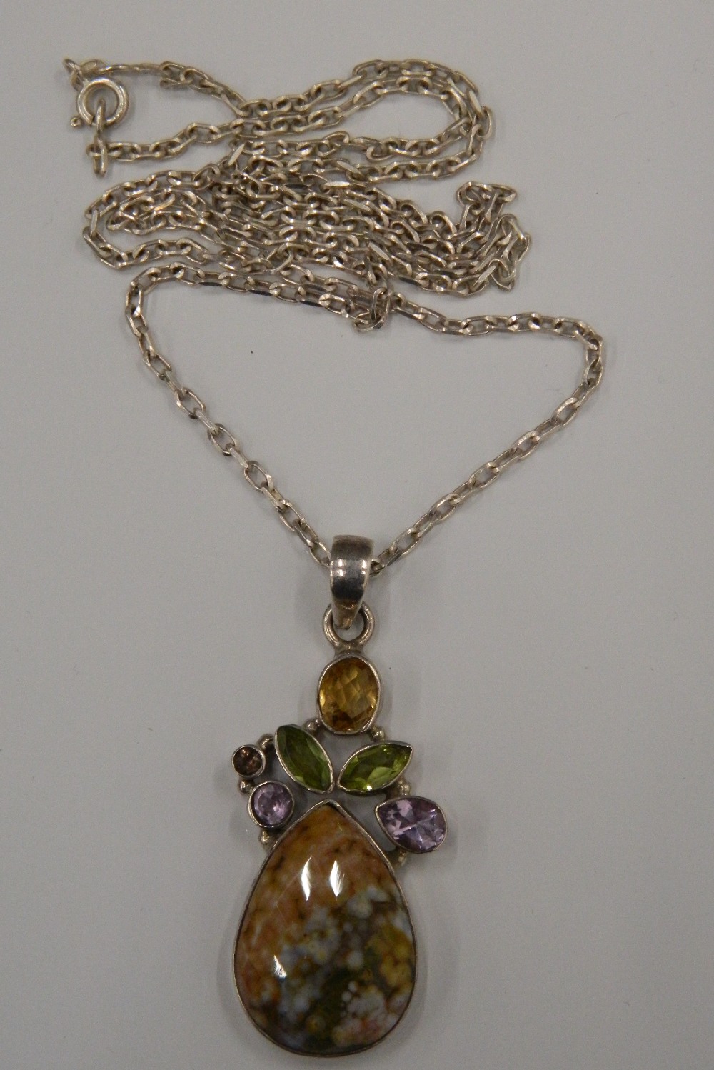 A multi-gem set silver pendant on chain. The pendant 4. - Image 2 of 2