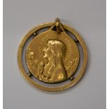 A 9 ct gold religious pendant - 'Je Suis L'Immaculee Conception'. 1.8 cm diameter (2.2 grammes).