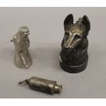 An Acme whistle, a dog formed desk lighter and a model horses head. The lighter 12 cm high.