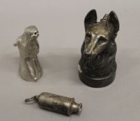 An Acme whistle, a dog formed desk lighter and a model horses head. The lighter 12 cm high.