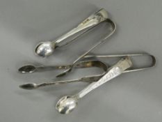 Four sets of silver tongs and a set of plated tongs. Largest 12 cm long (115.