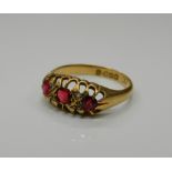 An 18 ct gold ruby and diamond ring. Ring size O/P (2.