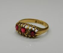 An 18 ct gold ruby and diamond ring. Ring size O/P (2.