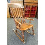 A Victorian splat back rocking chair. 52.5 cm wide.
