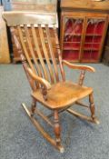 A Victorian splat back rocking chair. 52.5 cm wide.