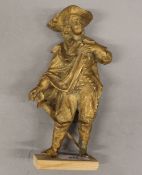 A gilt spelter model of a cavalier. 20 cm high.