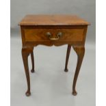 An early 20th century walnut side table. 45 cm wide.