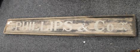 A painted wooden trade sign. 168 cm long.