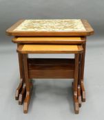 A 20th century retro nest of three tables. 49 cm wide.