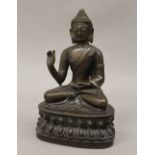 A bronze model of Buddha. 20 cm high.