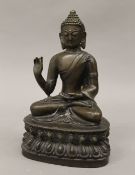 A bronze model of Buddha. 20 cm high.