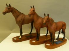 Three Beswick racehorses, including Arkle and Mill Reef. The largest 30 cm high.