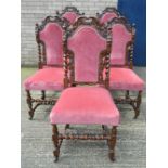 A set of seven Victorian carved oak dining chairs. The carvers 63 cm wide.