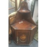 An Edwardian inlaid mahogany hanging corner cupboard. 75 cm high.